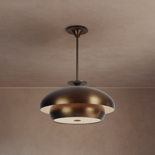 Lemieux et Cie Solene Chandelier, tiered pendant fixture with rounded dome and ring forms, suspended from slim rod in warm plaster-walled interior.