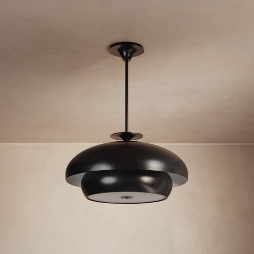 Lemieux et Cie Solene Chandelier, dark matte pendant with layered rounded forms, suspended against neutral plaster ceiling and walls in soft ambient light.