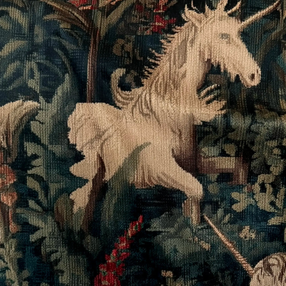 Lemieux et Cie Unicorn Velvet Pillow detail, woven tapestry motif with ivory unicorn amid dark foliage and blooms on performance velvet surface