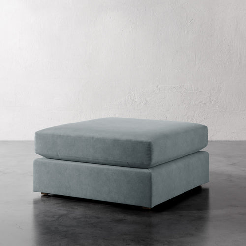 Lemieux Et Cie Chanaux Ottoman
Gray ottoman on a reflective surface with a white wall background