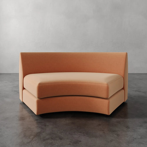 Lemieux Et Cie Rulmann Wedge Orange sofa against a gray background