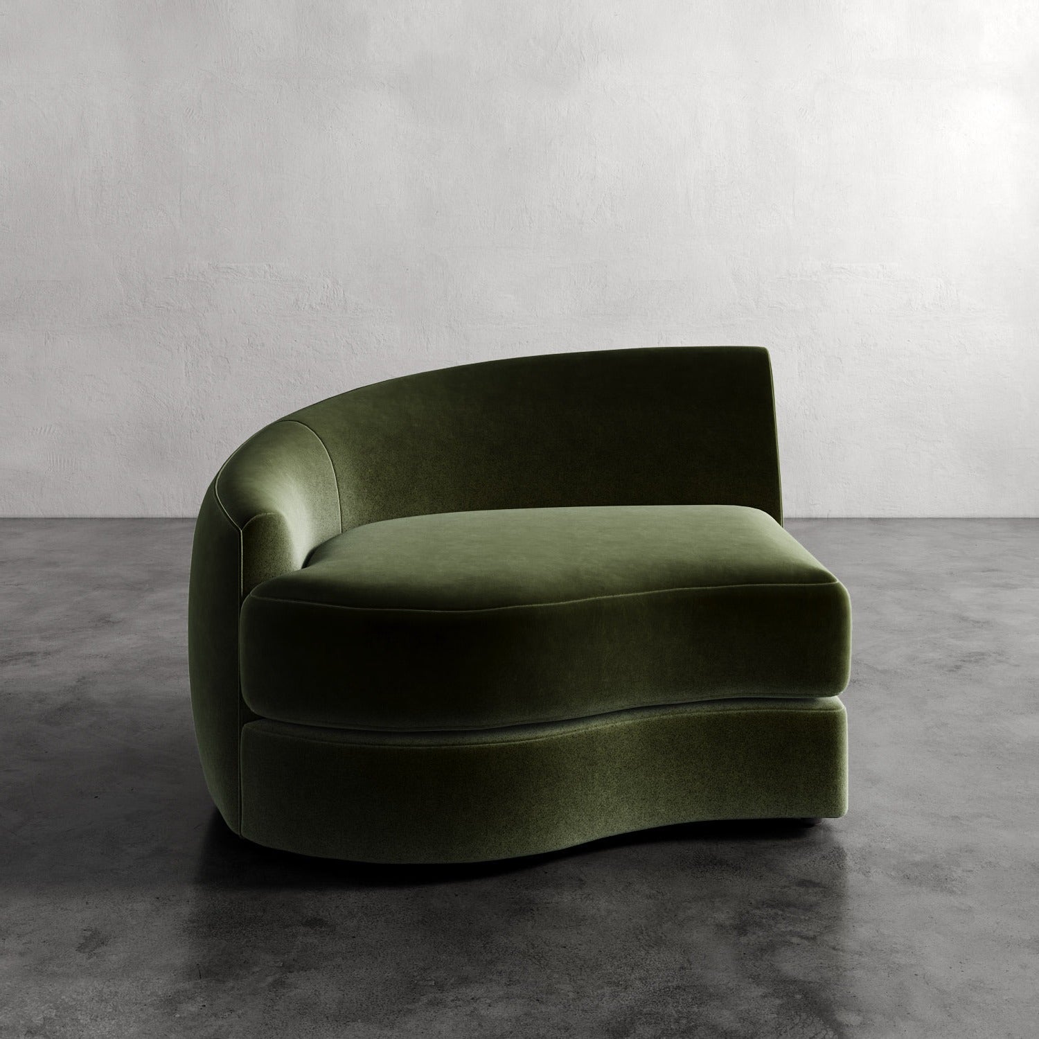 Lemieux Et Cie Rulmann Left Arm Chair Green curved sofa against a plain wall
