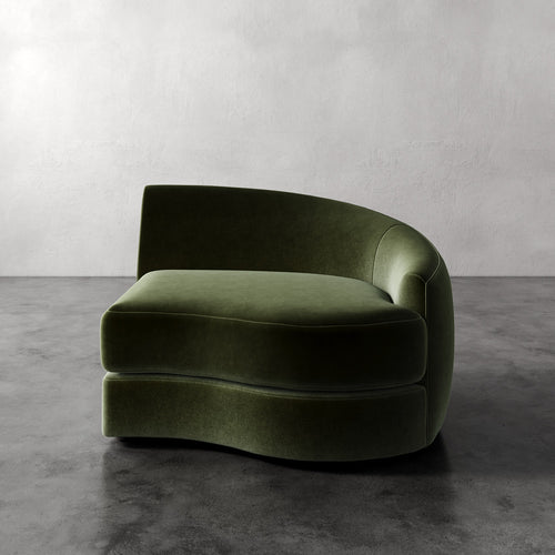 Lemieux Et Cie Rulmann Right Arm Chair Green curved sofa against a plain wall