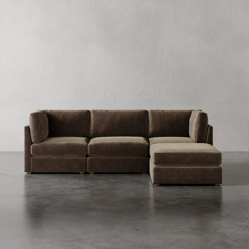 Lemieux Et Cie Chanaux 4-Pc Sectional Brown sectional sofa on a gray floor with a plain white wall background