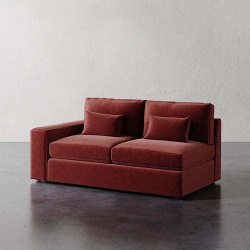 Lemieux Et Cie Lacroix Left or Right Arm Loveseat Red sofa with two cushions on a gray floor and white wall background