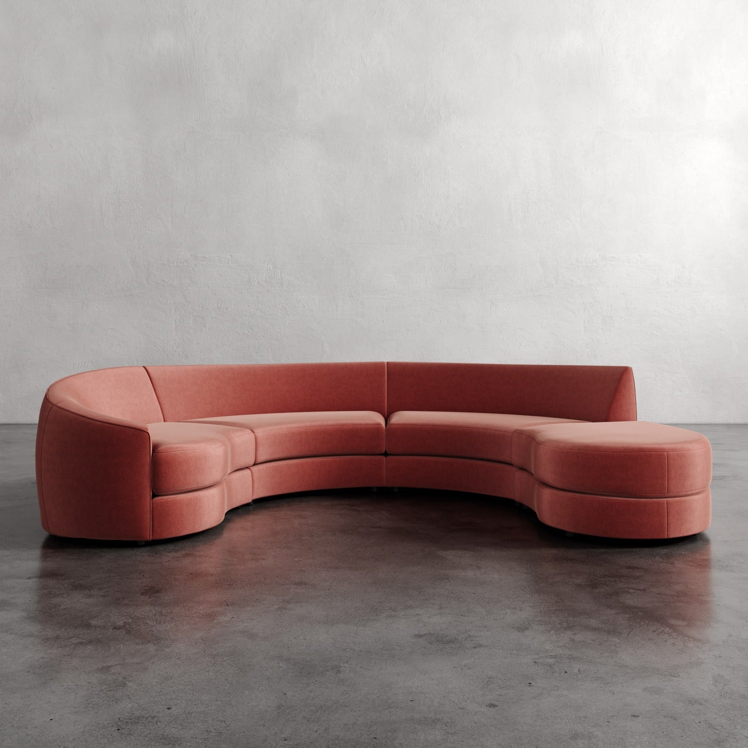 Lemieux Et Cie Rulmann 4-Piece Left Sectional Curved pink sofa on a gray floor with a plain wall background