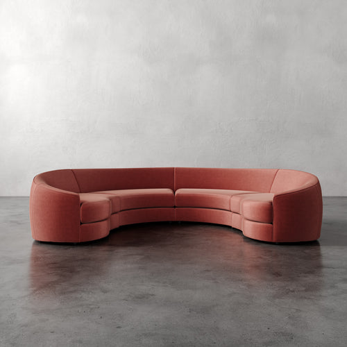 Lemieux Et Cie Rulmann 4-Piece Sectional Curved red sofa on a gray floor with a neutral background