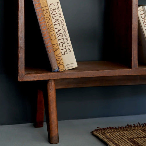 Lemieux et Cie Pierre Jeanneret bookcase in solid teak - close-up of the full-height open bay at the left with a leaning book
