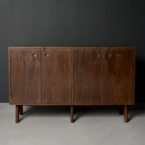 Lemieux et Cie Pierre Jeanneret four-door cabinet in solid teak, c. 1955 from Panjab University, Chandigarh - front studio view showing the four doors with recessed circular pulls and tapered cylindrical legs