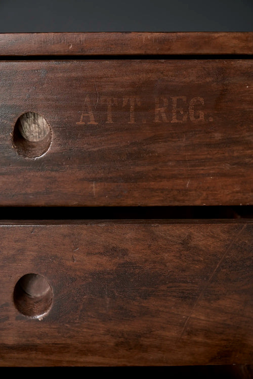 Lemieux et Cie Pierre Jeanneret library storage cabinet in solid teak - close-up of the top drawers with the original painted ATT. REG. label and circular cutout pulls