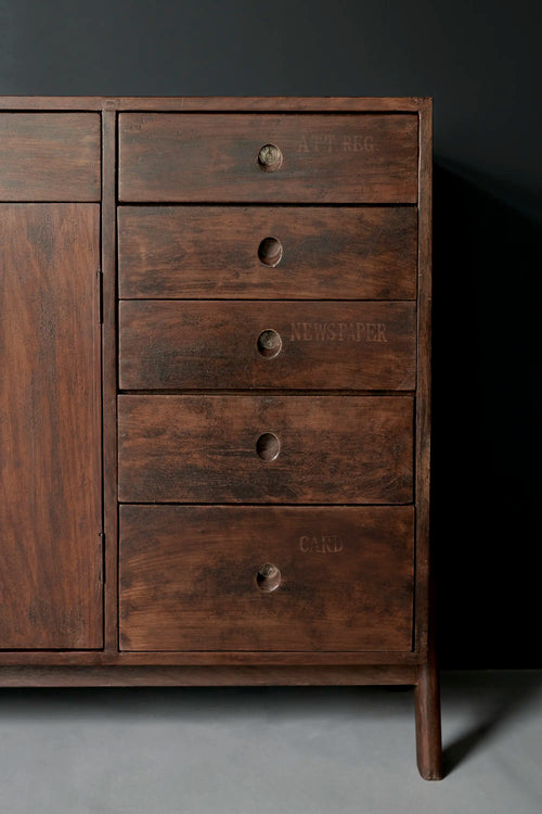Lemieux et Cie Pierre Jeanneret library storage cabinet in solid teak - three-quarter view of the right-hand column of five drawers with circular cutout pulls