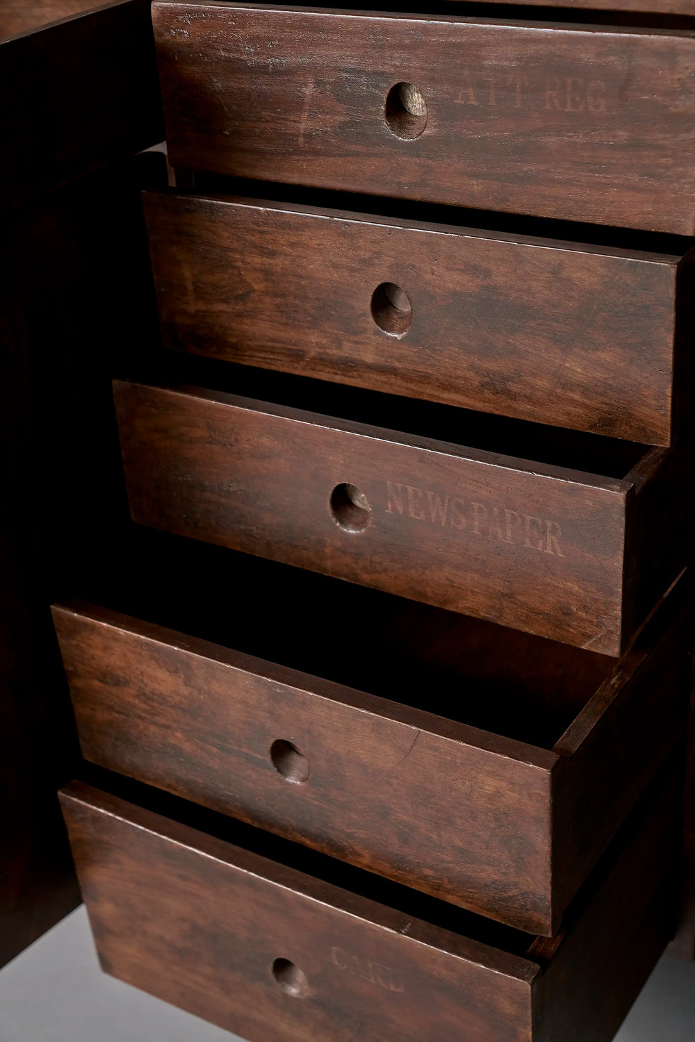 Lemieux et Cie Pierre Jeanneret library storage cabinet in solid teak - the five-drawer column open in a cascade, showing the original painted labels