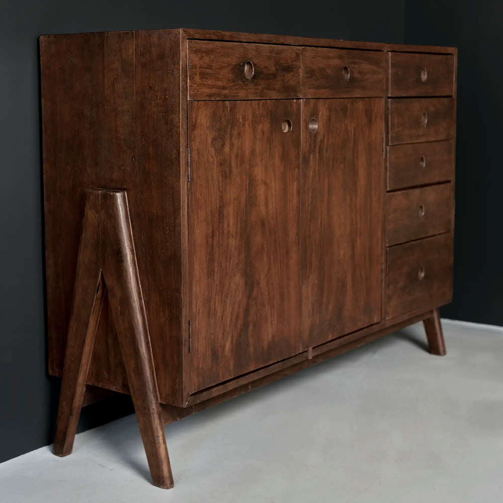 Lemieux et Cie Pierre Jeanneret library storage cabinet in solid teak - three-quarter view showing the doors, drawers and compass A-frame legs