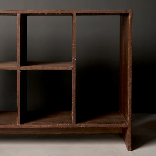 Lemieux et Cie Pierre Jeanneret low bookcase in solid teak - three-quarter view of the open compartments and the full-width plinth base