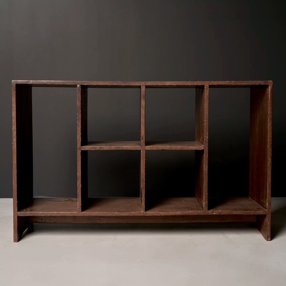 Lemieux et Cie Pierre Jeanneret low bookcase in solid teak, c. 1960, PGIMER, Chandigarh - front view showing six open compartments in two tiers of three, with side panels extending to form the legs and a low plinth base