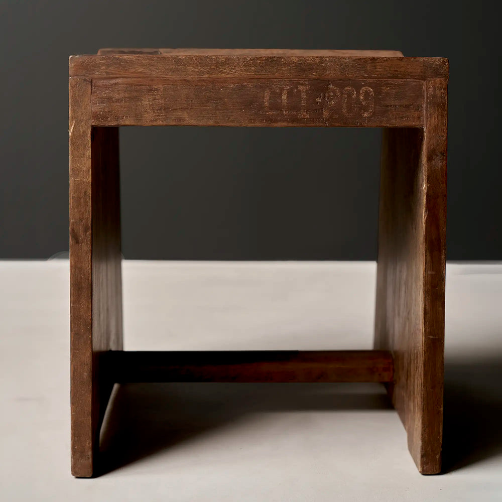 Lemieux et Cie Pierre Jeanneret stool in solid teak with the CCI/209 institutional stencil, c. 1960, Capitol Complex, Chandigarh - front view with the CCI/209 stencil on the apron, flat slab legs and a concave saddle seat