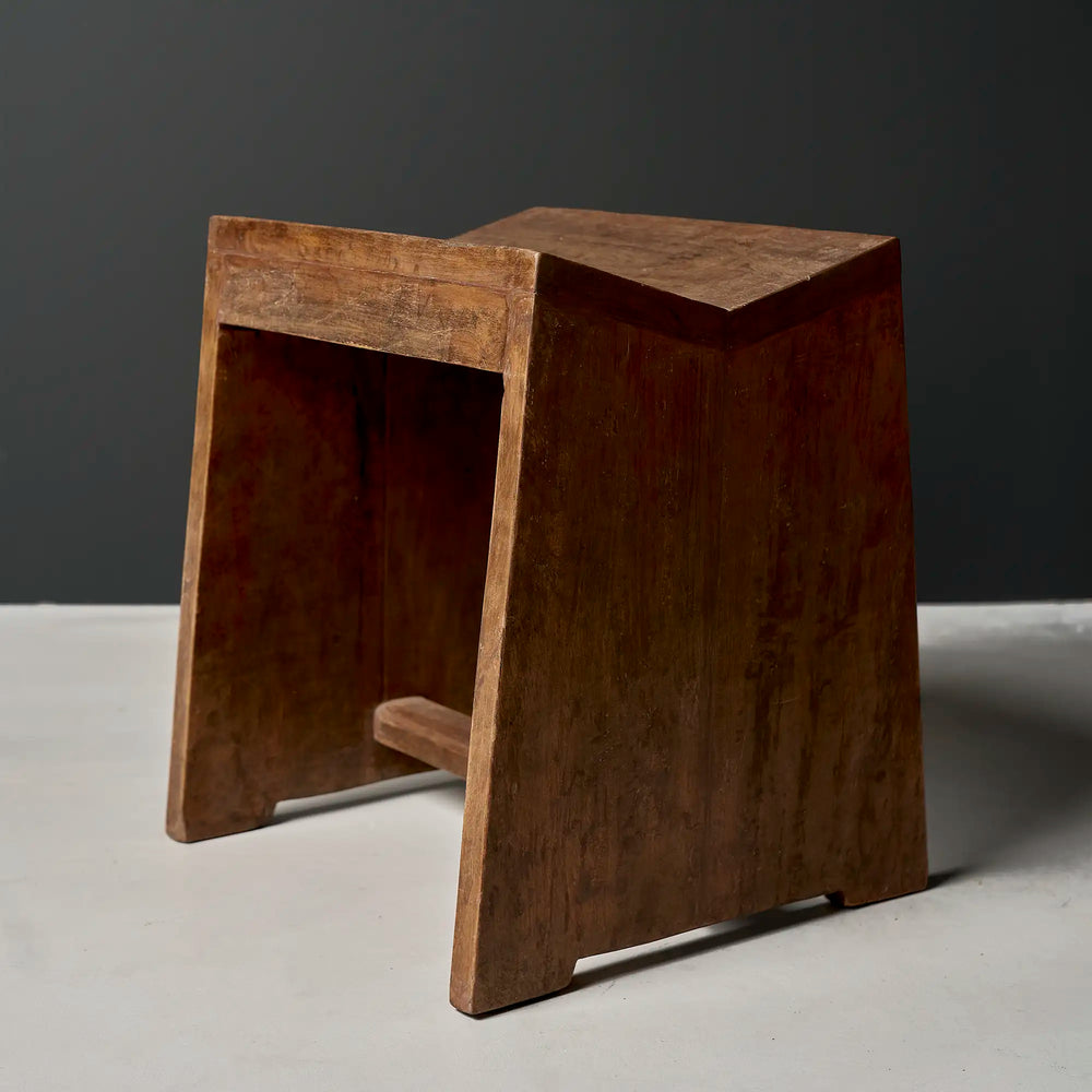 Lemieux et Cie Pierre Jeanneret stool in solid teak, c. 1960, Capitol Complex, Chandigarh - a single stool with flat slab legs joined by a stretcher and a concave saddle seat