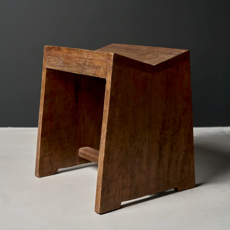 Lemieux et Cie Pierre Jeanneret stool in solid teak, c. 1960, Capitol Complex, Chandigarh - a single stool with flat slab legs joined by a stretcher and a concave saddle seat