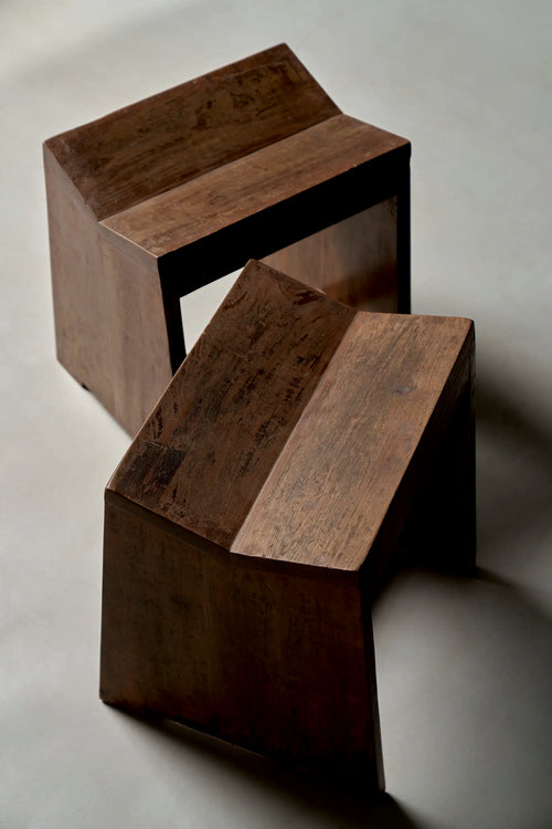 Lemieux et Cie Pierre Jeanneret stool in solid teak - two stools arranged at angles, showing the flat slab legs and saddle seats
