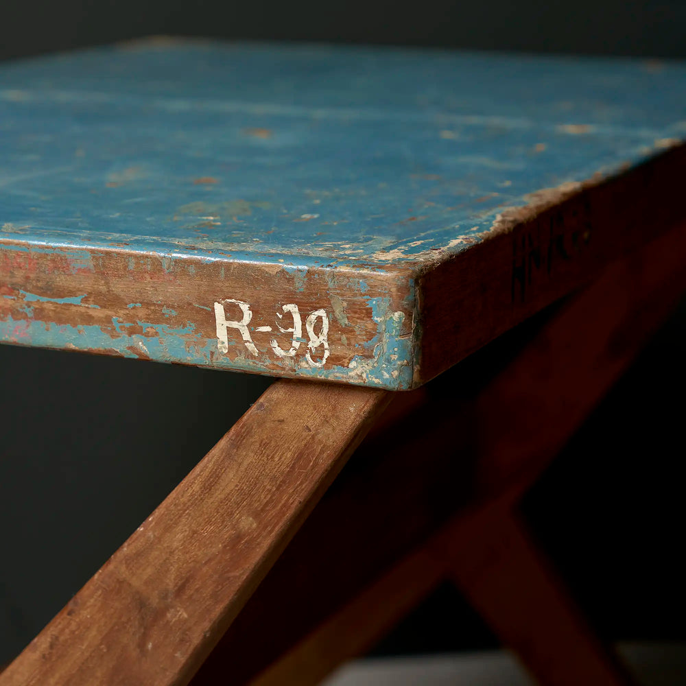 Lemieux et Cie Pierre Jeanneret X-leg student desk with original blue painted top - corner close-up with the R-98 room inventory marking on the blue painted top