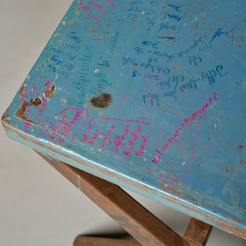 Lemieux et Cie Pierre Jeanneret X-leg student desk with original blue painted top - close-up of handwritten student inscriptions and equations on the blue painted top