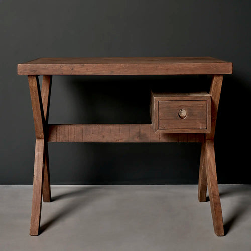Lemieux et Cie Pierre Jeanneret writing desk in solid teak, c. 1960, Library, Punjab Engineering College, Chandigarh - front view showing the rectangular slab top on two X-leg frames, with a single suspended drawer right of center and a circular cutout pull