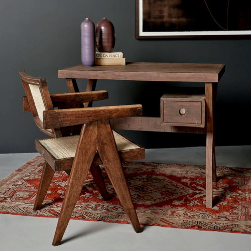 Lemieux et Cie Pierre Jeanneret writing desk in solid teak - styled wide scene with a teak armchair, books and ceramics