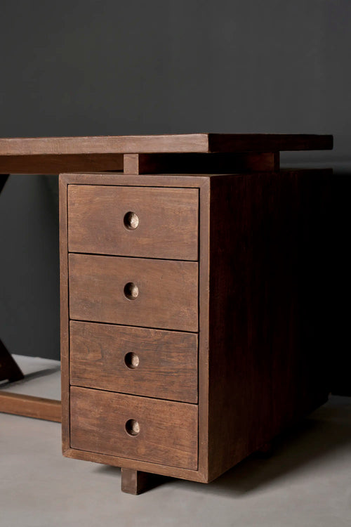 Lemieux et Cie Pierre Jeanneret writing desk in solid teak - three-quarter view of the integrated pedestal with four stacked drawers and circular cutout pulls
