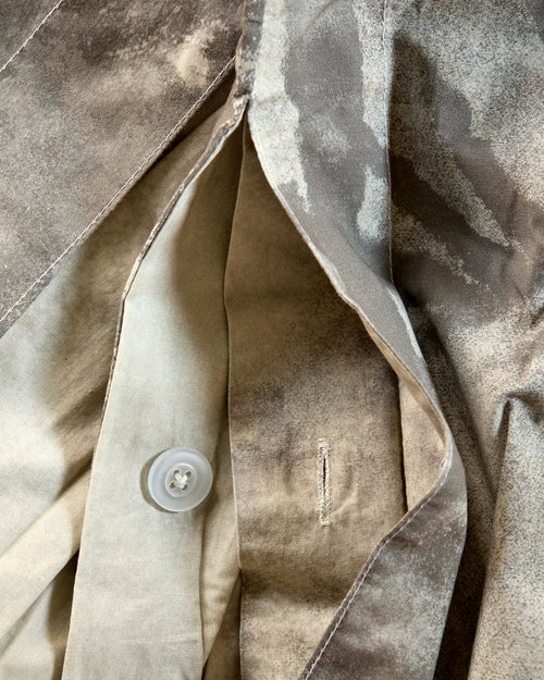 Close-up of Lemieux et Cie Provençal Scenic Landscape percale duvet cover with a button and stitching detail.