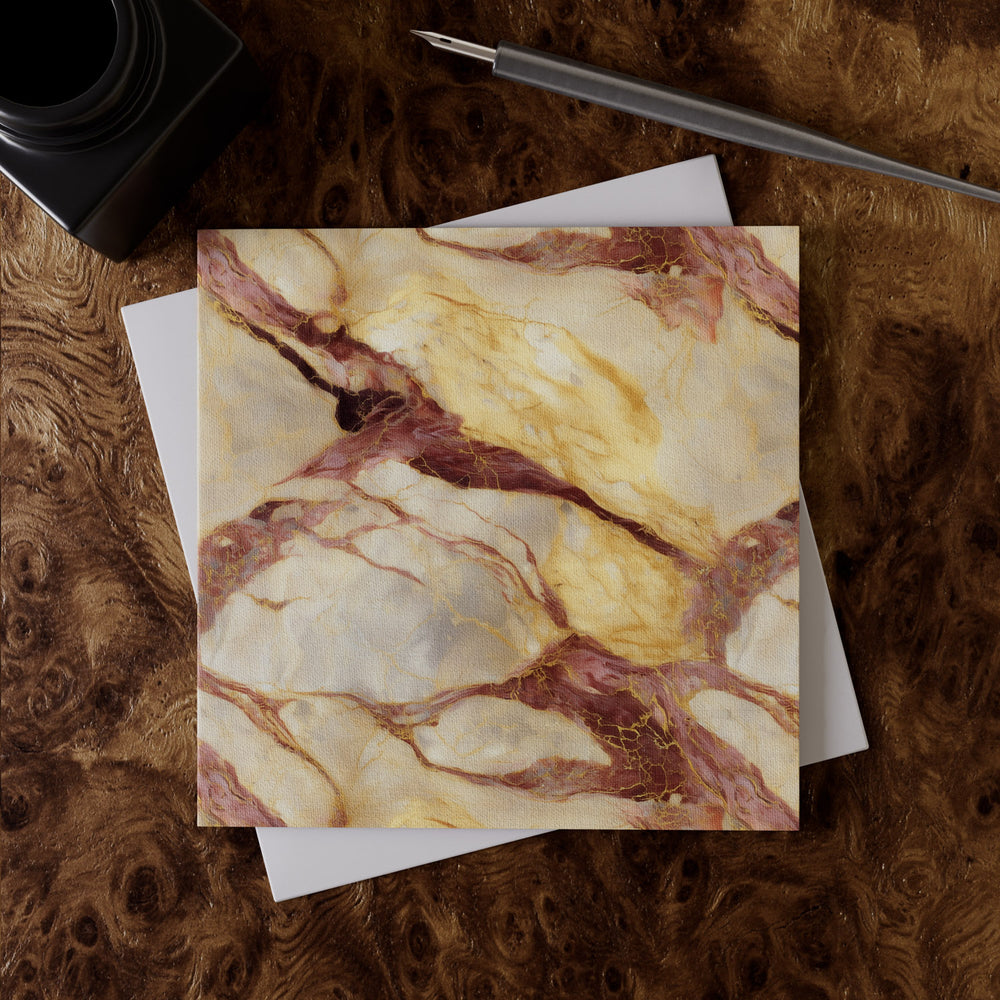 Lemieux et Cie Rosa Aurora Greeting Card Set with rose, gold and ivory marbled pattern on linen paper, shown on wood burl desk surface with pen and envelope.