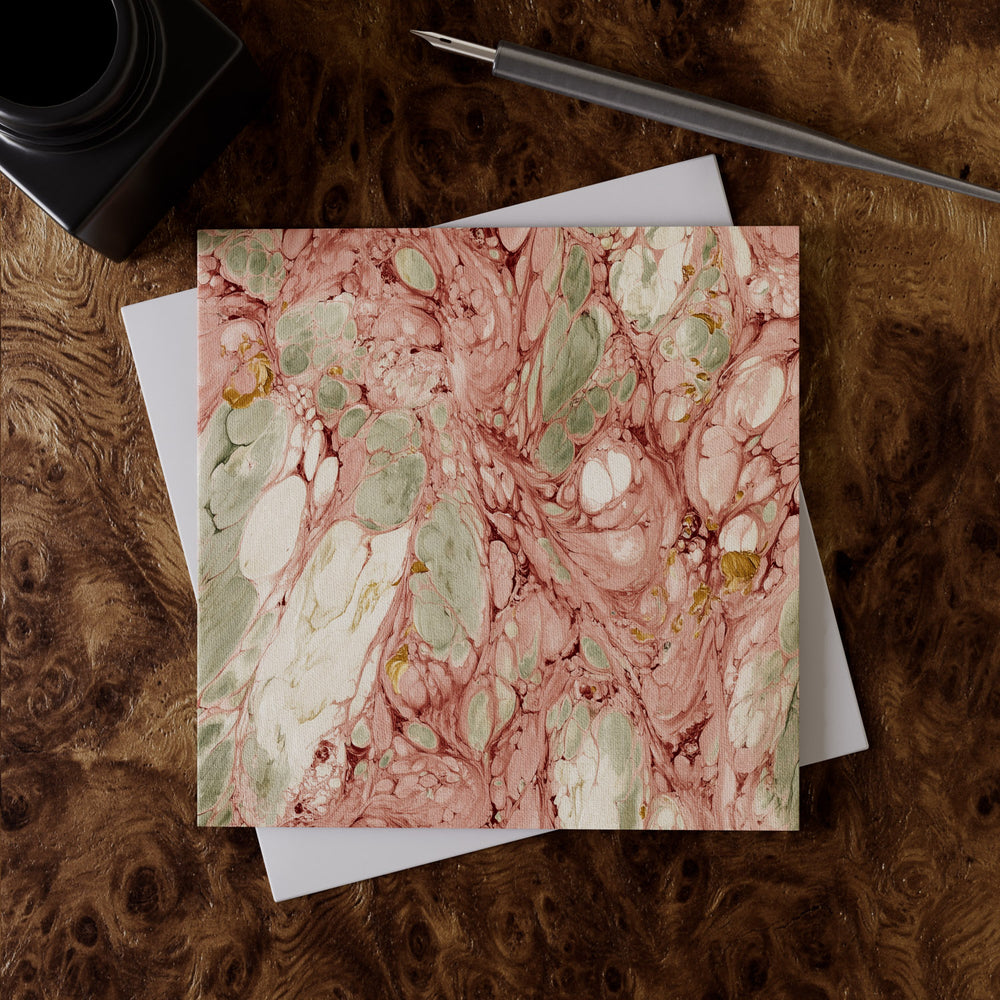 Lemieux et Cie Rosa Portogallo Greeting Card Set in blush, sage and ivory marbled pattern, shown on burl wood desk with pen and envelope.