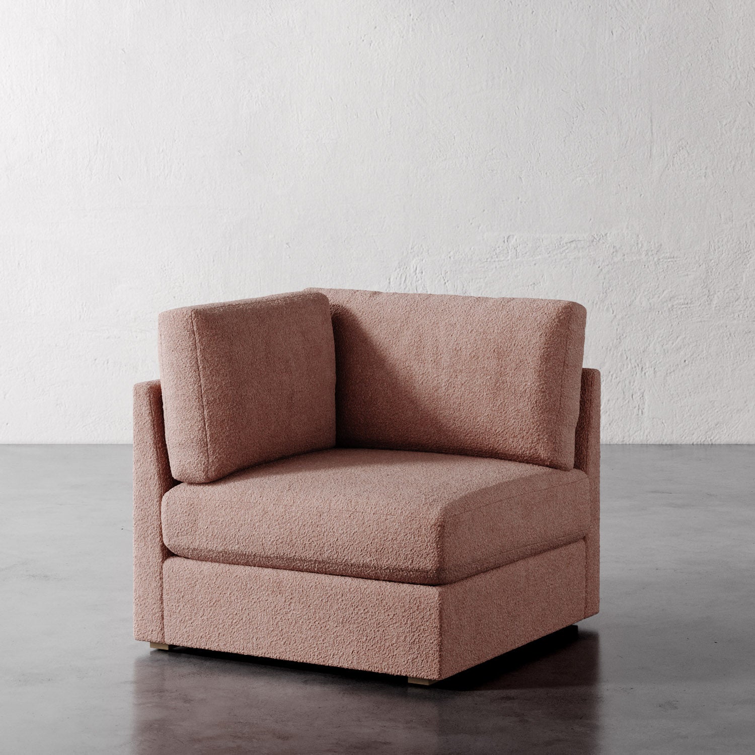 Lemieux Et Cie Chanaux Corner Chair_Brown armchair on a gray floor with a white textured wall background