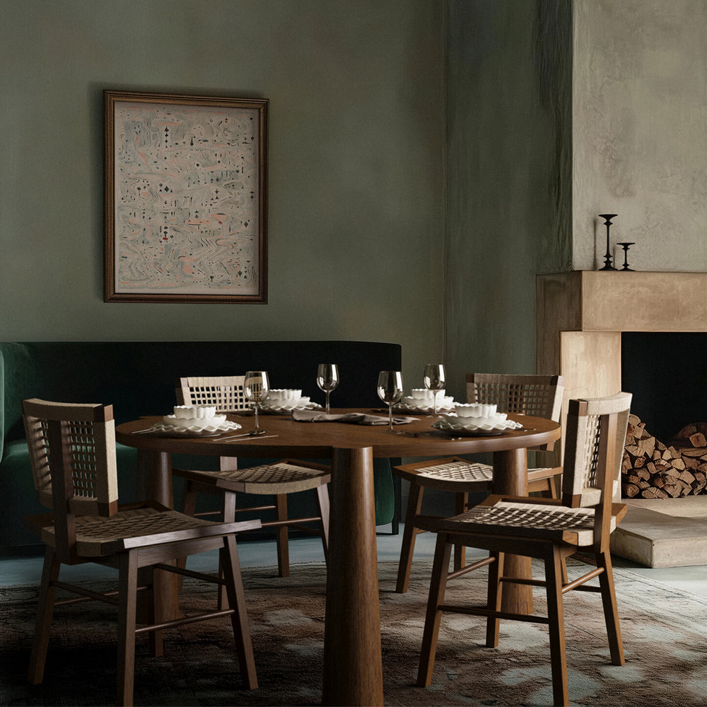 Lemieux et Cie Girard Dining Table in oak with flared legs, set for six in a dining room with sage green walls and wood flooring.