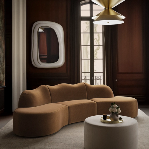 Lemieux Et Cie Serpentine  3-piece Sectional sophie anouarvase Epoquemirror chambord. Modern living room with a brown sofa, round mirror, and stylish lamp. 