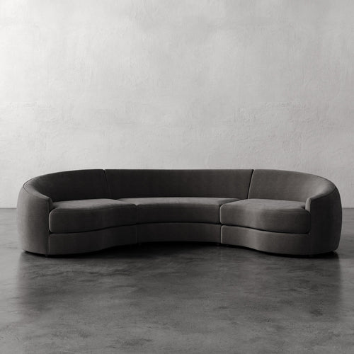 Lemieux Et Cie Rulmann Rulmann 3-Piece Sectional Modern gray sofa on a concrete floor with a plain wall background