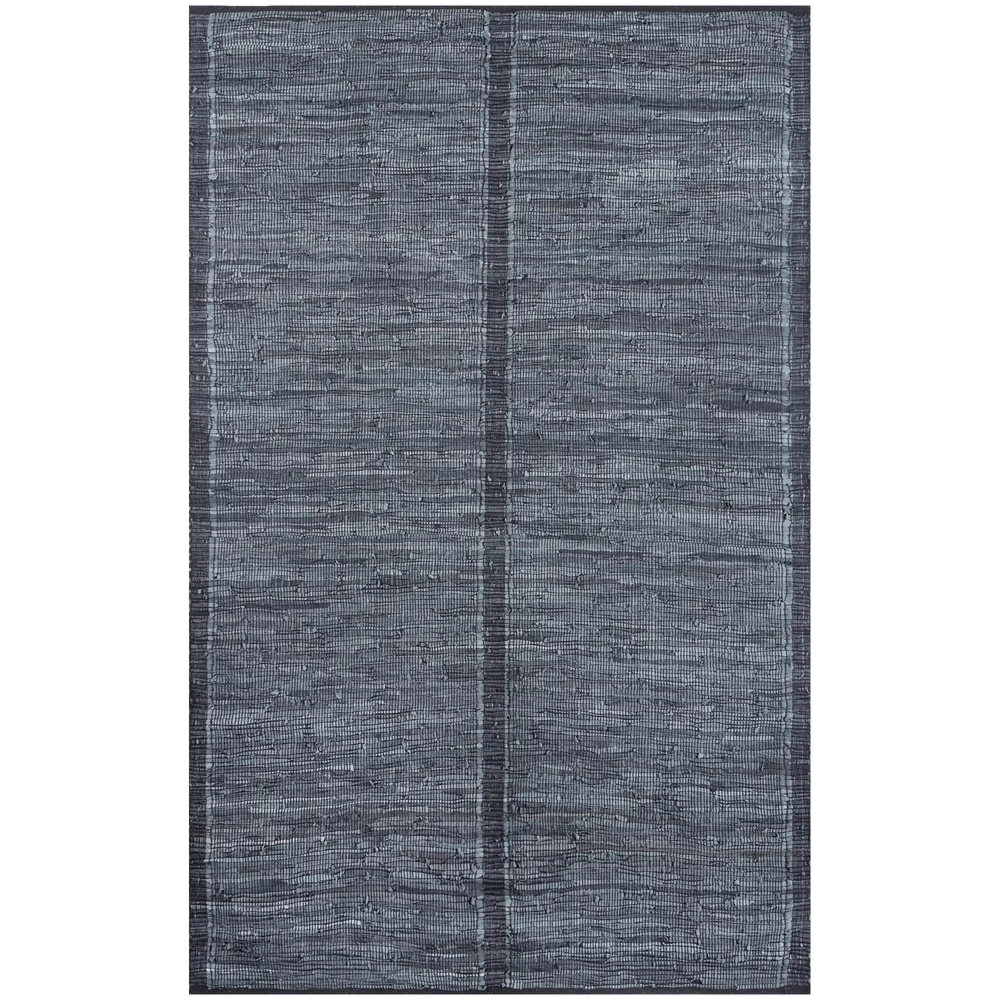Lemieux et Cie Tézah rug in slate blue handwoven recycled leather, geometric grid pattern, shown on white studio backdrop.