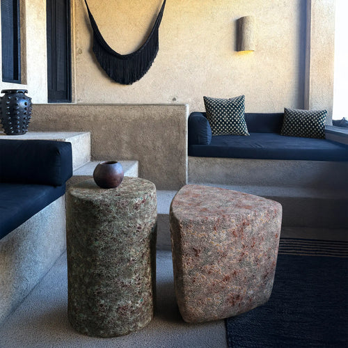 outdoor patio scene with the Enso Oxidized Jade ceramic end table and Kado Ember Ash stool with reactive glaze. Handmade for indoor and outdoor use. 