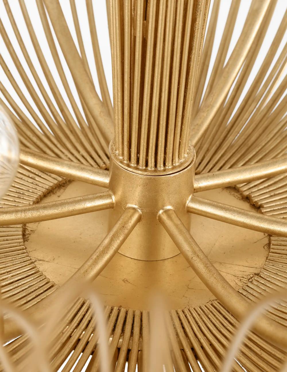 Lemieux et Cie Dorelle Chandelier detail, sculptural starburst form with radiating ridged rods extending from central cylindrical hub in warm gold finish.