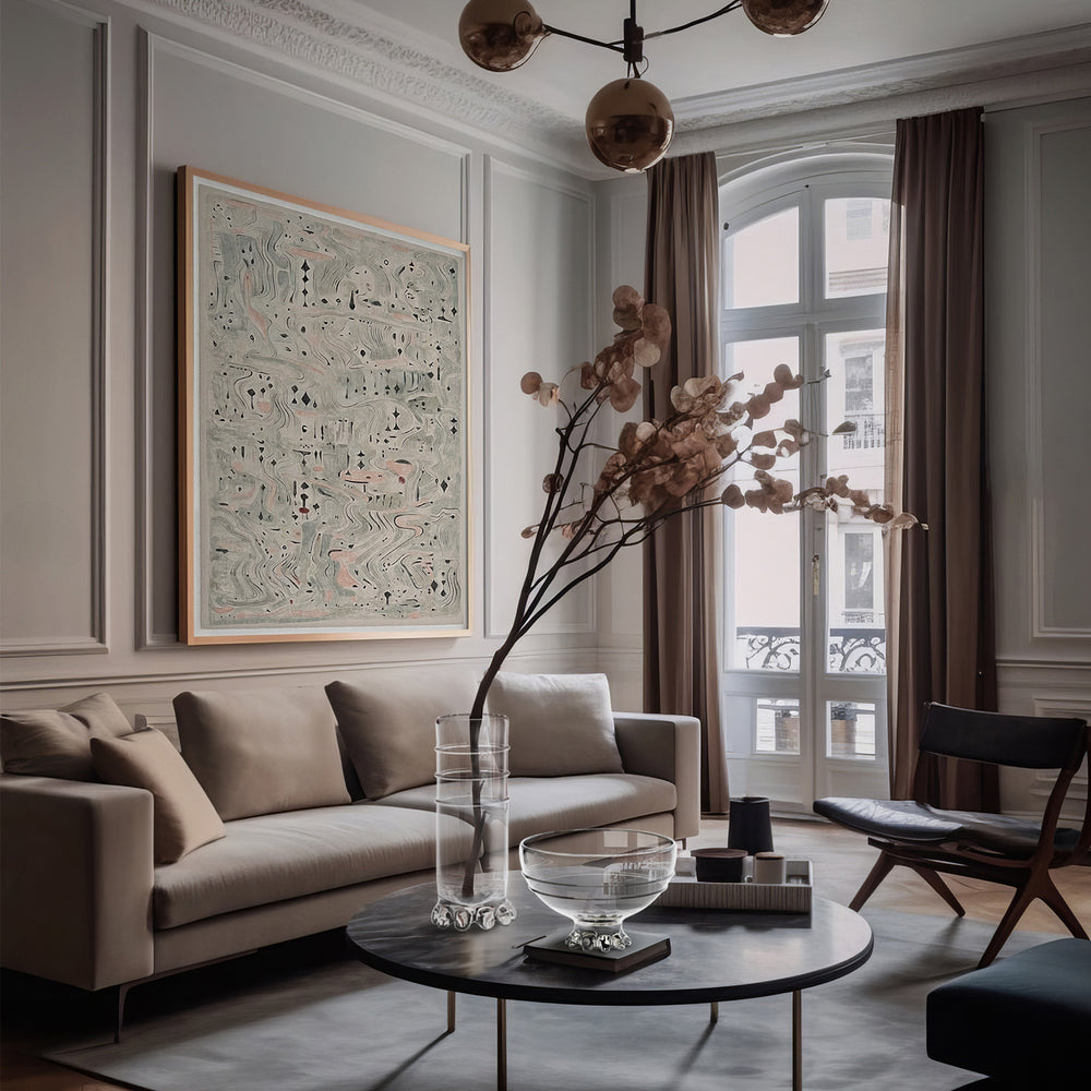 Lemieux et Cie Verre Lisse glass bowls and vases with organic bubbled bases, shown on dark round table in Parisian sitting room with white paneled walls.