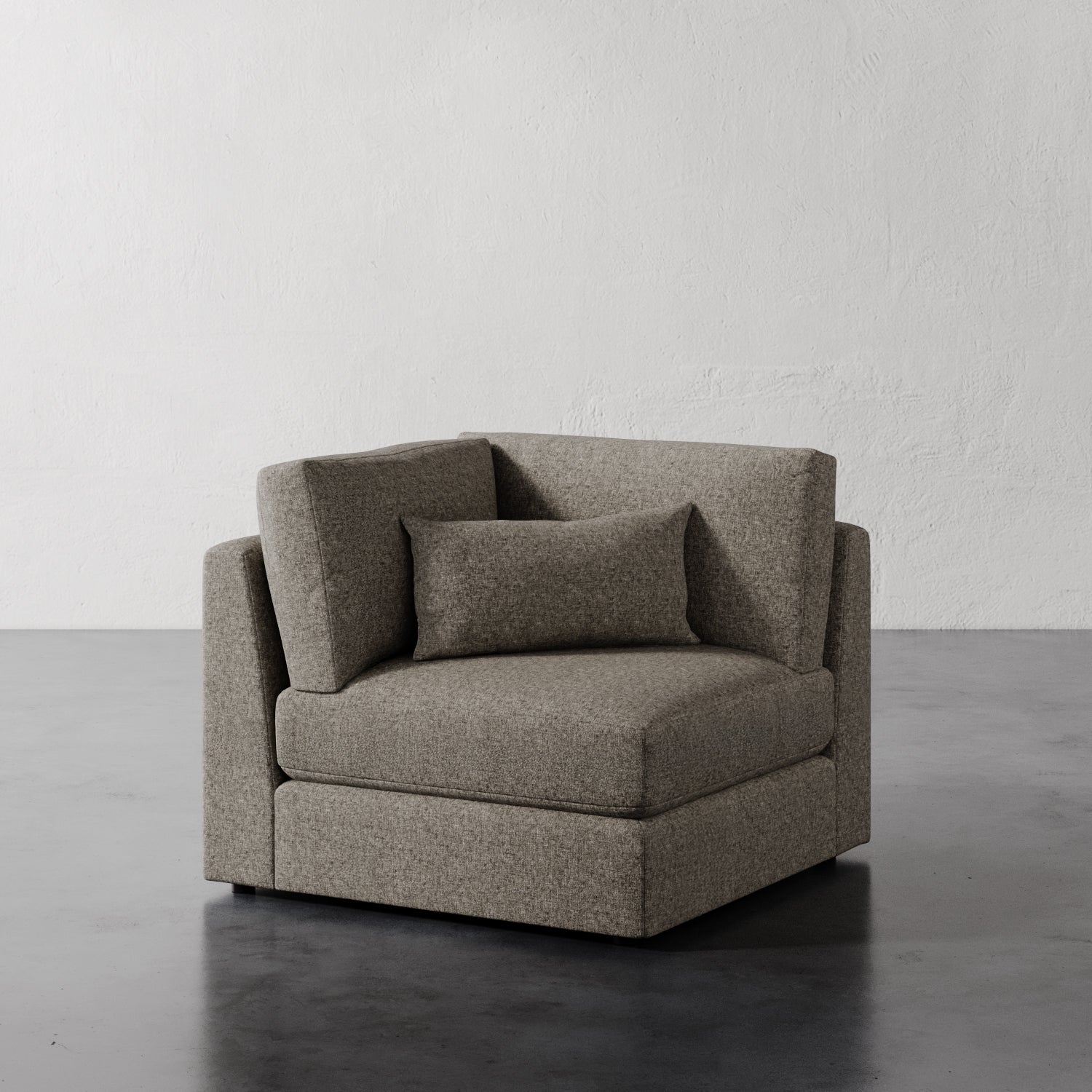 Lemieux Et Cie Lacroix Corner Chair Gray chair against a plain white wall.