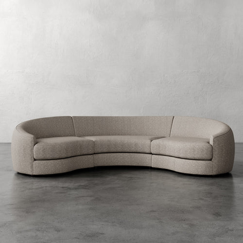 Lemieux Et Cie Rulmann Rulmann 3-Piece Sectional Curved beige sofa against a plain wall