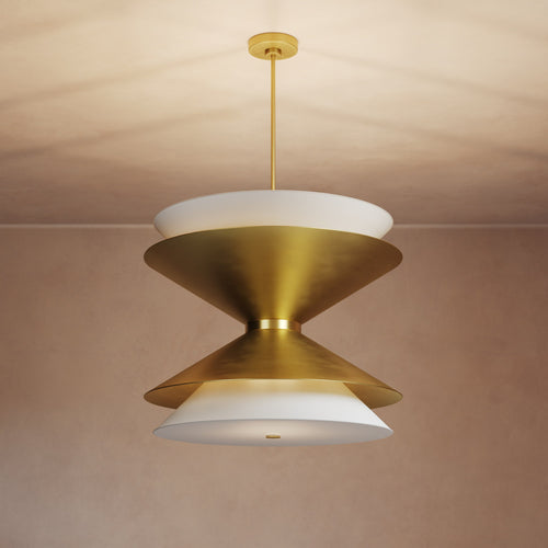 Lemieux et Cie Balleroy chandelier in brass with white dome shades, sculptural tiered pendant hung in a room with warm plaster ceiling.