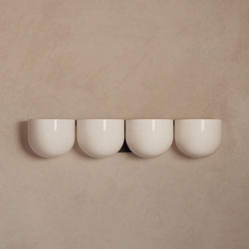 Lemieux et Cie Cocoon Lamp in ivory resin, four rounded diffusers in soft daylight against a neutral plaster wall.