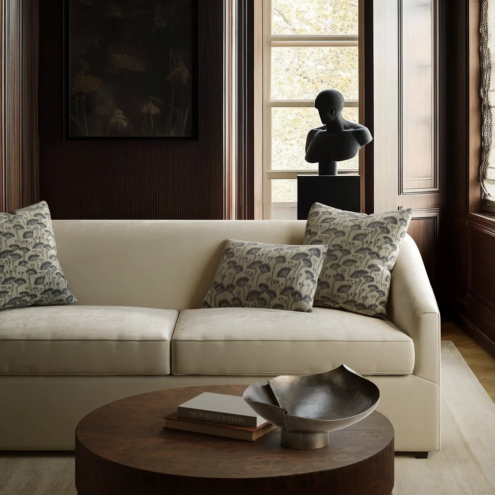 Linen decorative pillow cover with Japanese floral block print in deep indigo and sage on ecru ground, on the Arvelle sleeper sofa by lemieux et cie