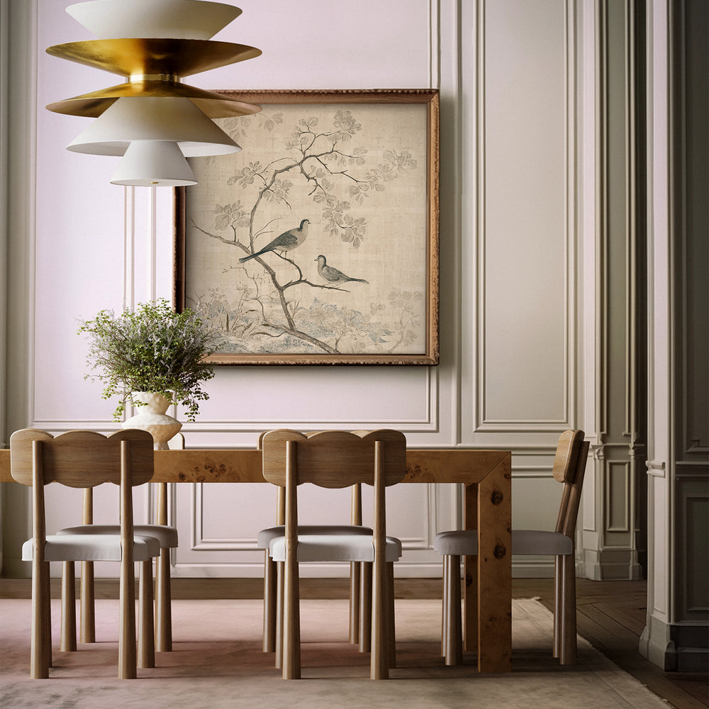 Lemieux et Cie Forêt de Lune archival print in charcoal and cream, chinoiserie-inspired birds on branches, hung in dining room with wood paneling and wood table.