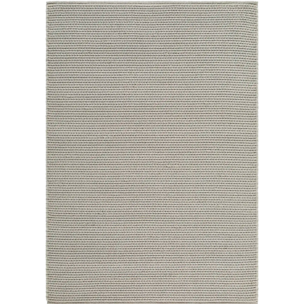 Lemieux et Cie Tricot Handwoven Outdoor Rug in grey, textured woven rug with horizontal ribbed pattern, shown on white studio backdrop.