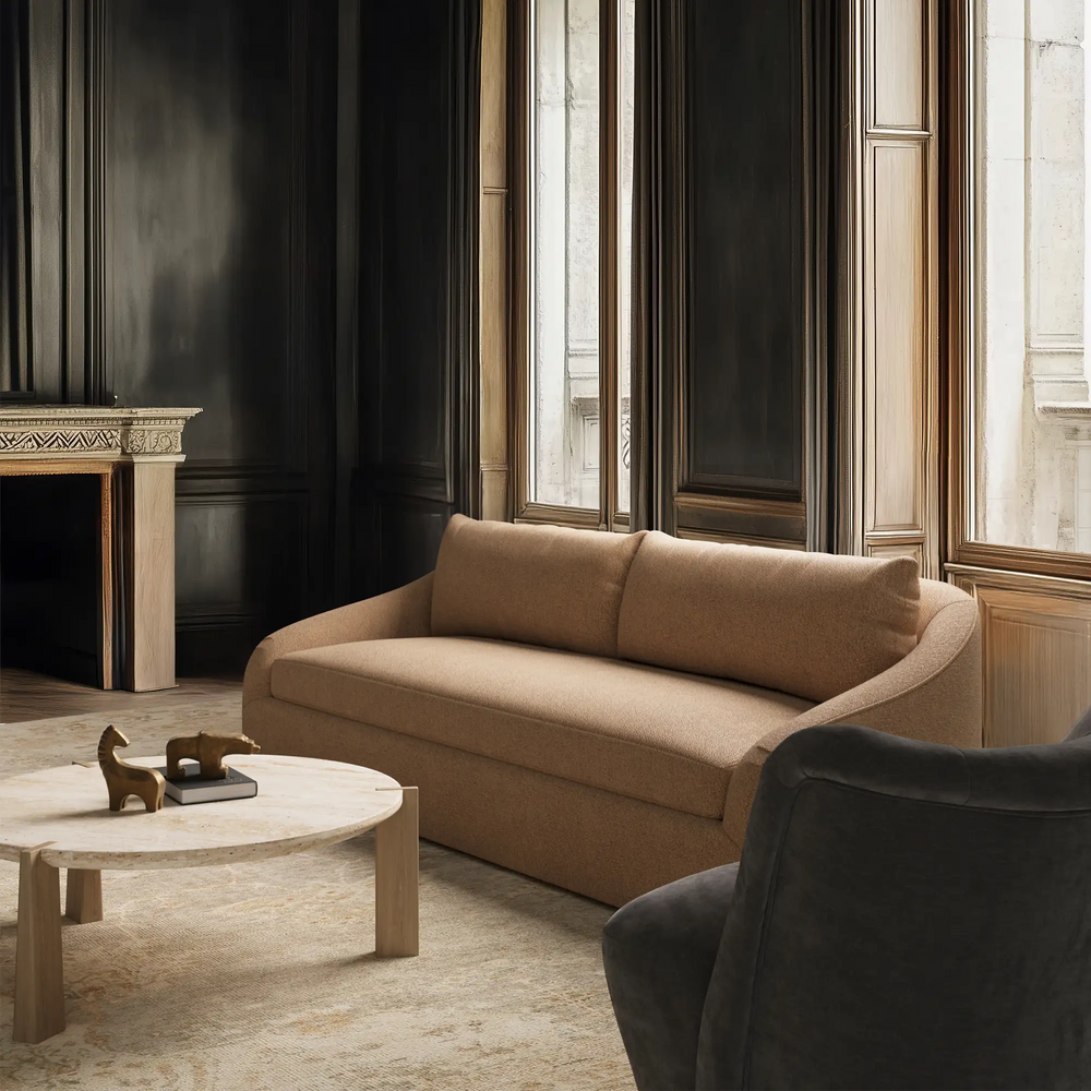 Lemieux et Cie Blanchet hand-knotted wool rug in warm neutral tones, shown in a Parisian sitting room with dark wood-paneled walls and stone flooring.