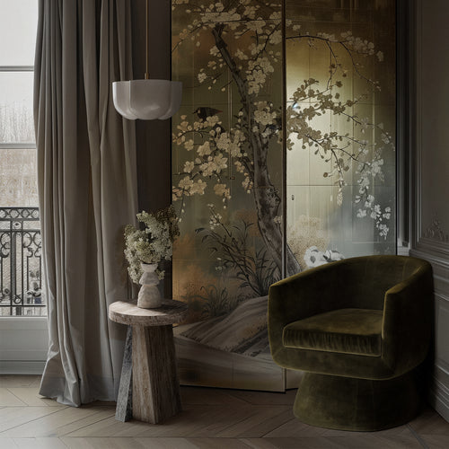 Lemieux et Cie Borel Side Table in walnut with sculptural angled form, beside chinoiserie wall panels and olive velvet chair in Parisian sitting room.