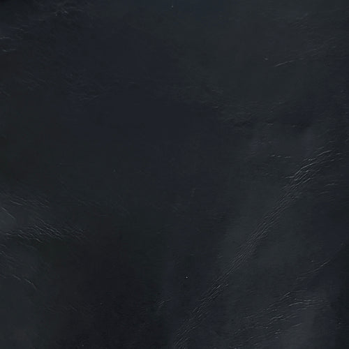 Lemieux et Cie Aniline Leather Swatches, dark textured leather material sample with visible grain detail shown against dark surface.