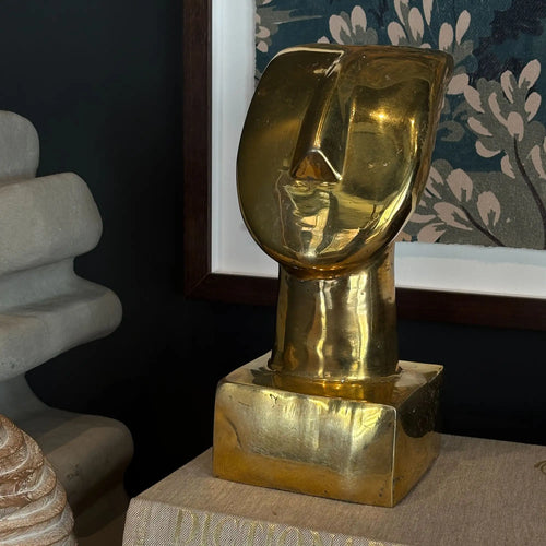 Lemieux et Cie Vintage Art Deco Abstract Brass Bust Sculpture, polished brass with warm patina, styled on console near floral artwork and seating